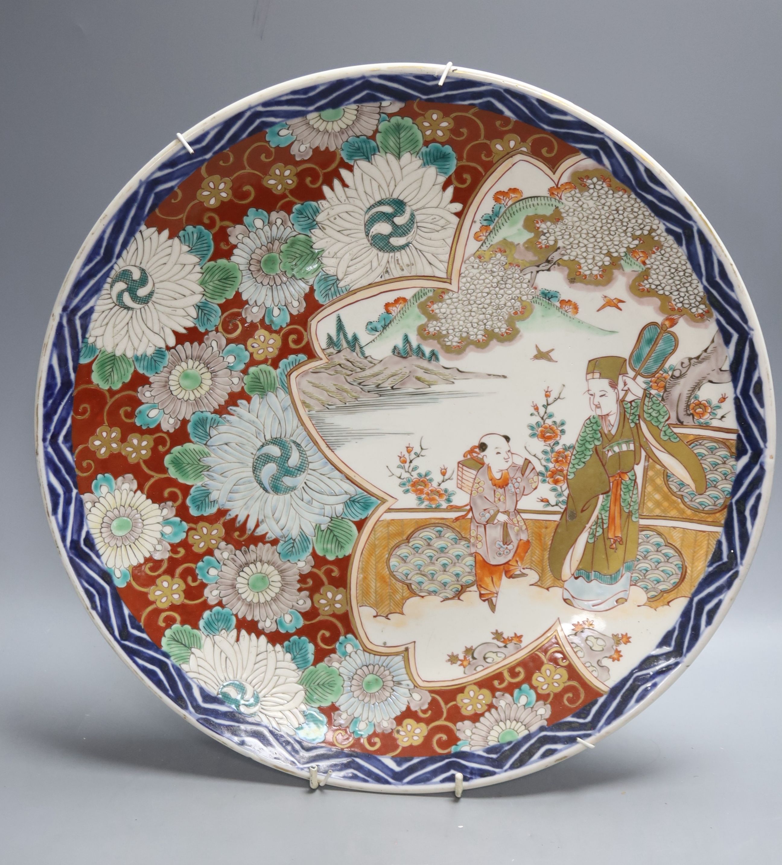 A Japanese Imari charger, a Kutani jar and cover and a Satsuma vase, diameter 40cm